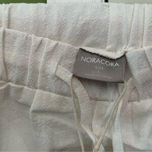 New, with tags. Size Large white pants.